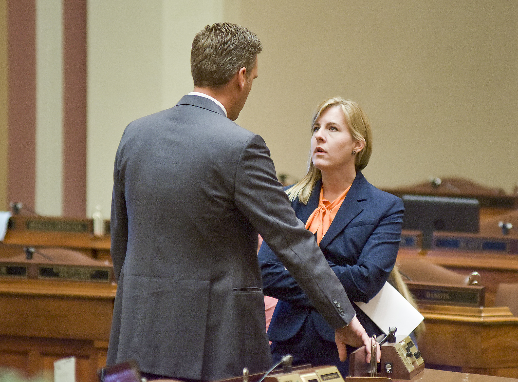 House Speaker Kurt Daudt and House Minority Leader Melissa Hortman confer on the House Floor during a recess early Thursday afternoon. Photo by Andrew VonBank